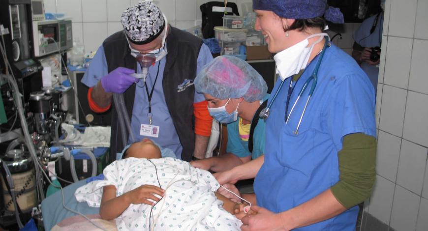 Dr. Weber and assistants working on a patient