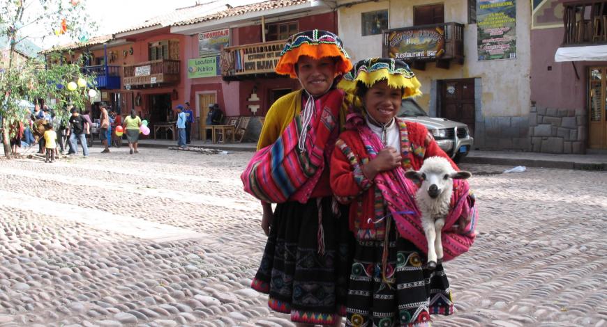 Two women with colorful, local clothing