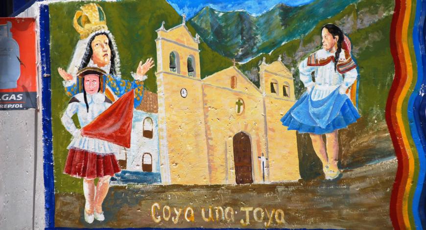 Mural of two girls in dresses in front of a building