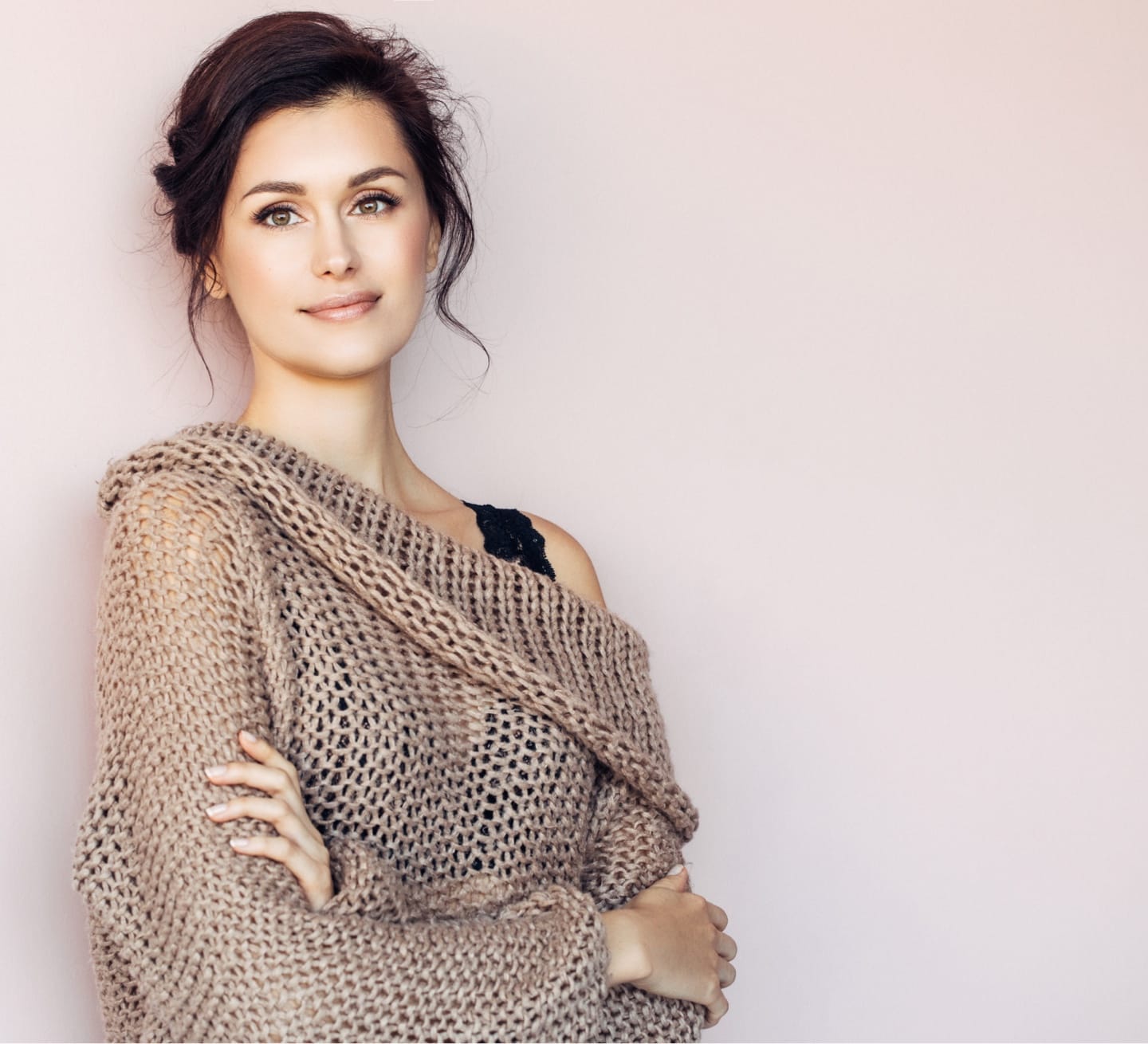 Brown-haired woman wearing a brown sweater