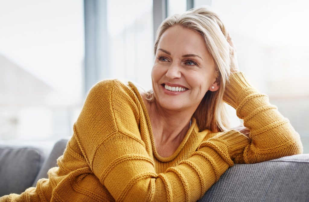 woman smiling on couch